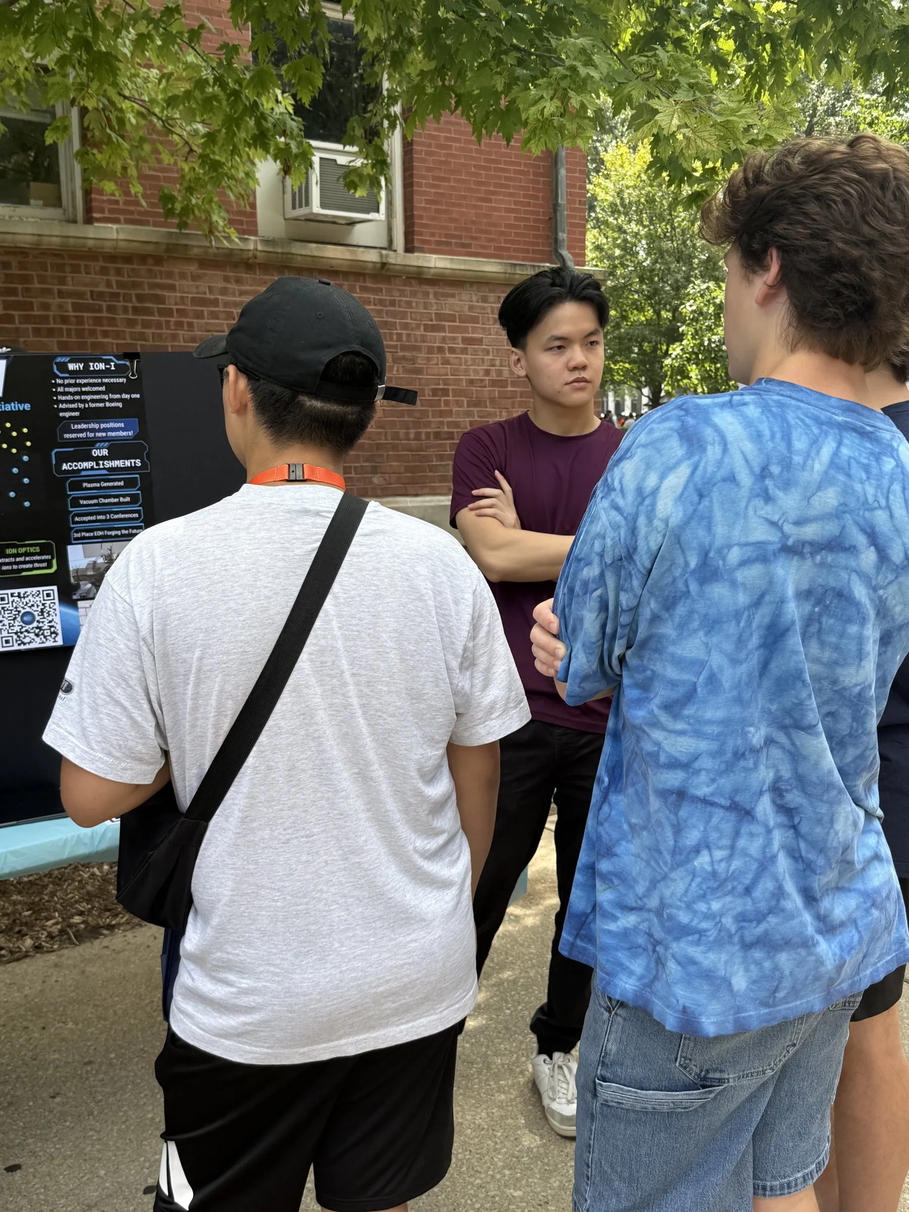 Members explaining the project at the booth