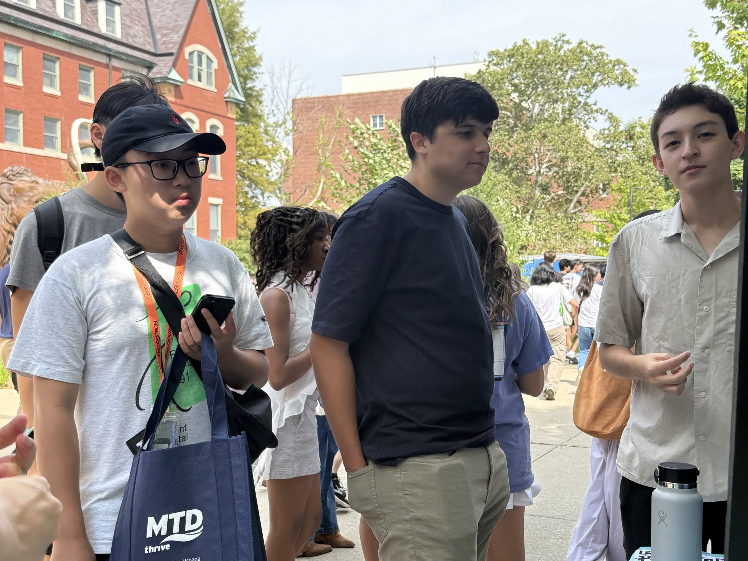 Students talking with members at the ION-I Quad Day booth
